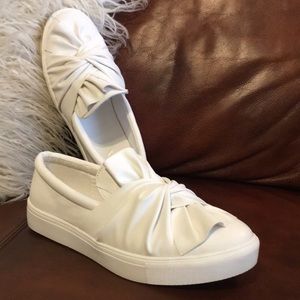 While twist slip on shoes